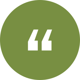 White quotation mark symbol inside a green circle.