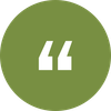 White quotation mark symbol inside a green circle.