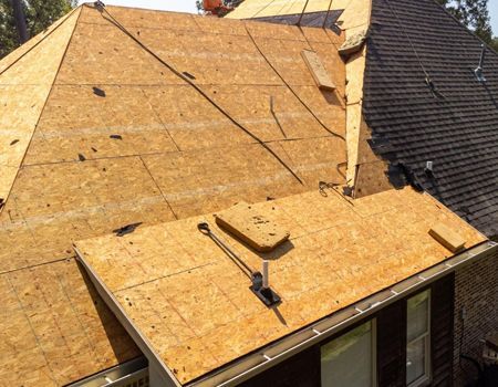 A roof is being installed on a house.