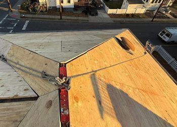 An aerial view of a wooden roof under construction.