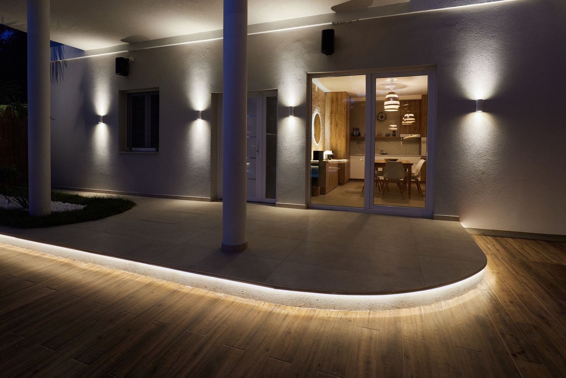a patio with a lot of lights on it at night