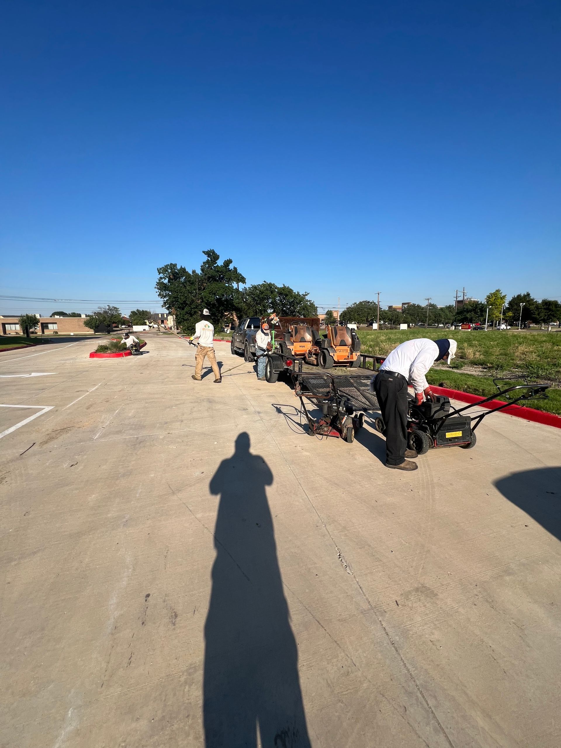 A shadow of a person is cast on a concrete surface