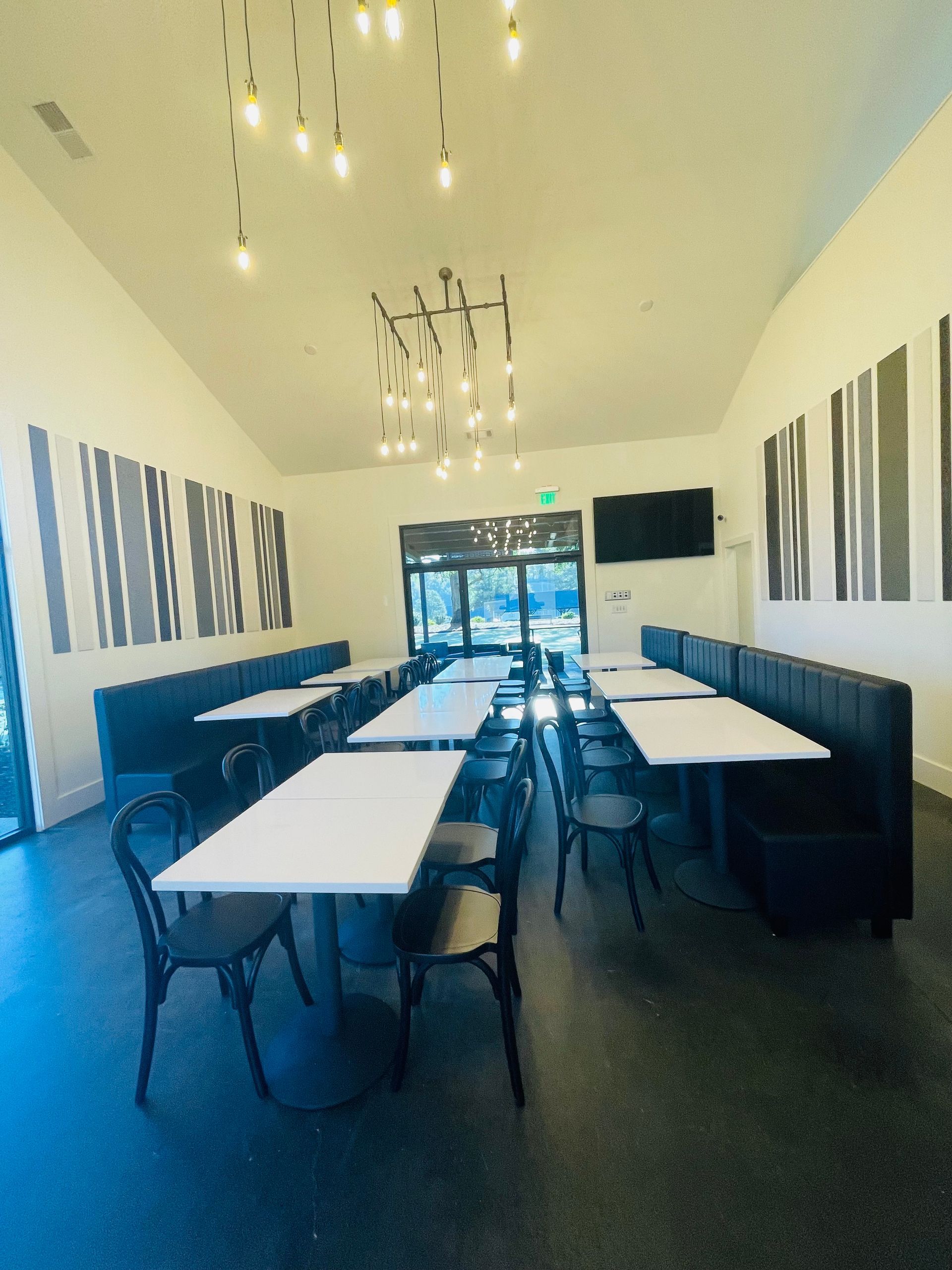 A large room with tables and chairs in it