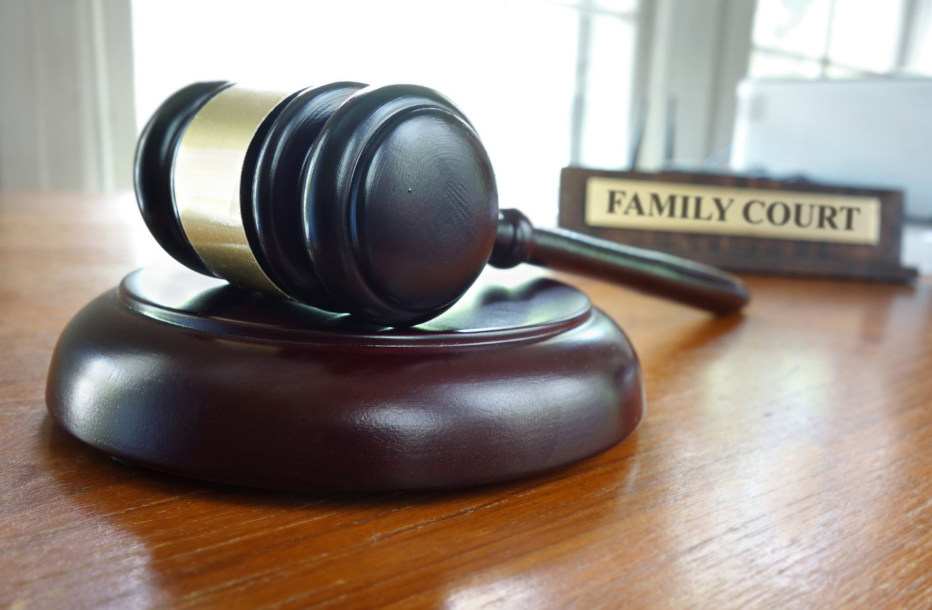 Close-up of family court gavel used by judge during legal cases handled by a family lawyer.