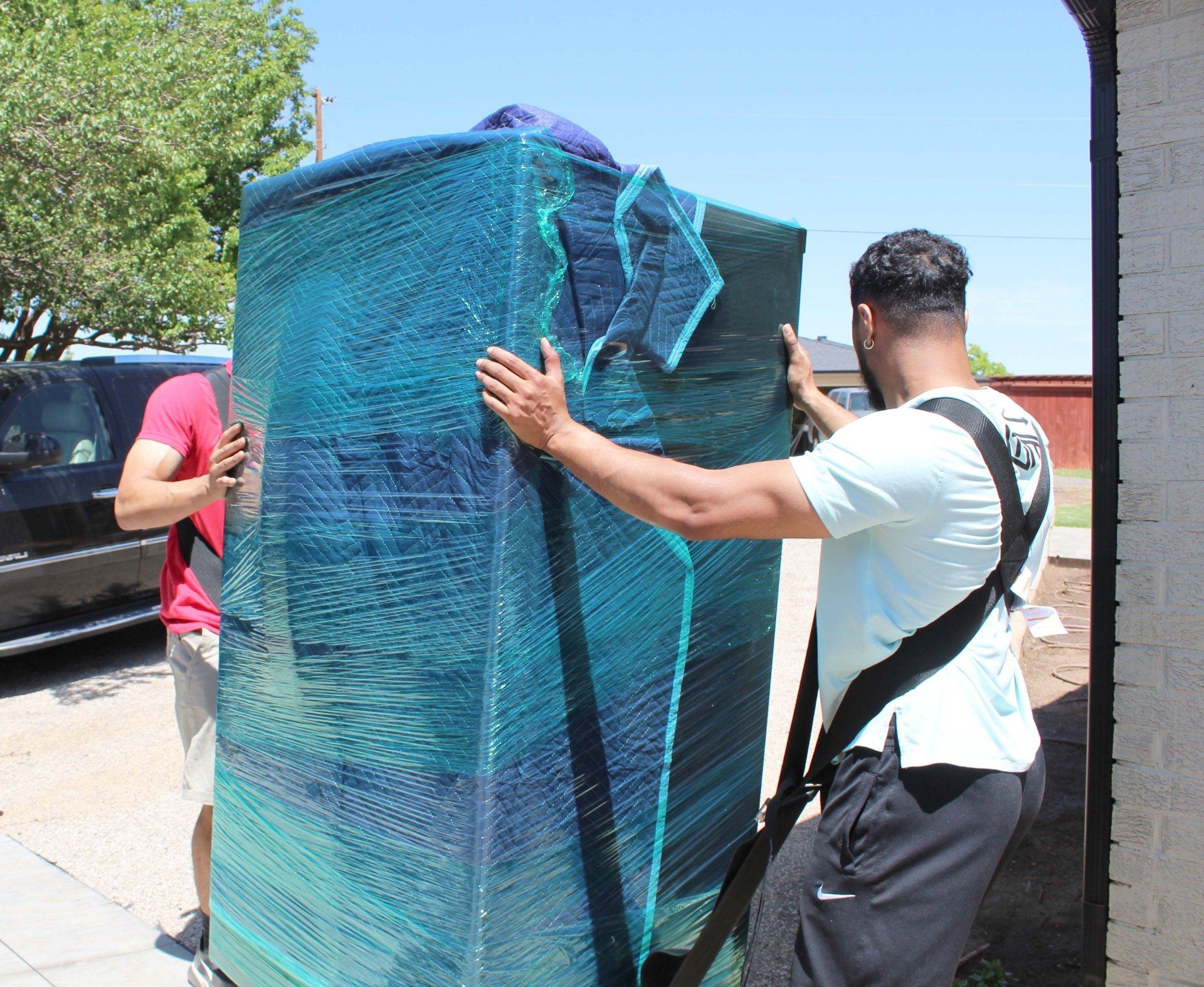 Full-service moving truck being loaded with furniture