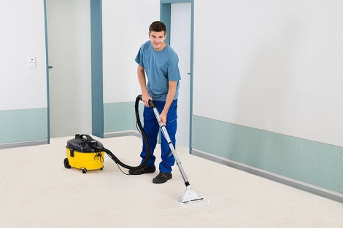 Man cleaning the floor — Odessa, FL — Gator Cleaning Solutions