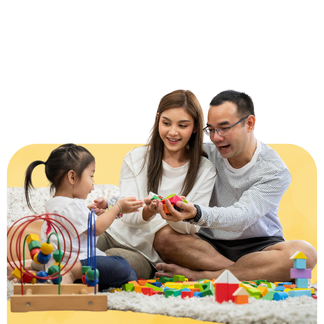 A woman is holding a little girl who is wearing glasses