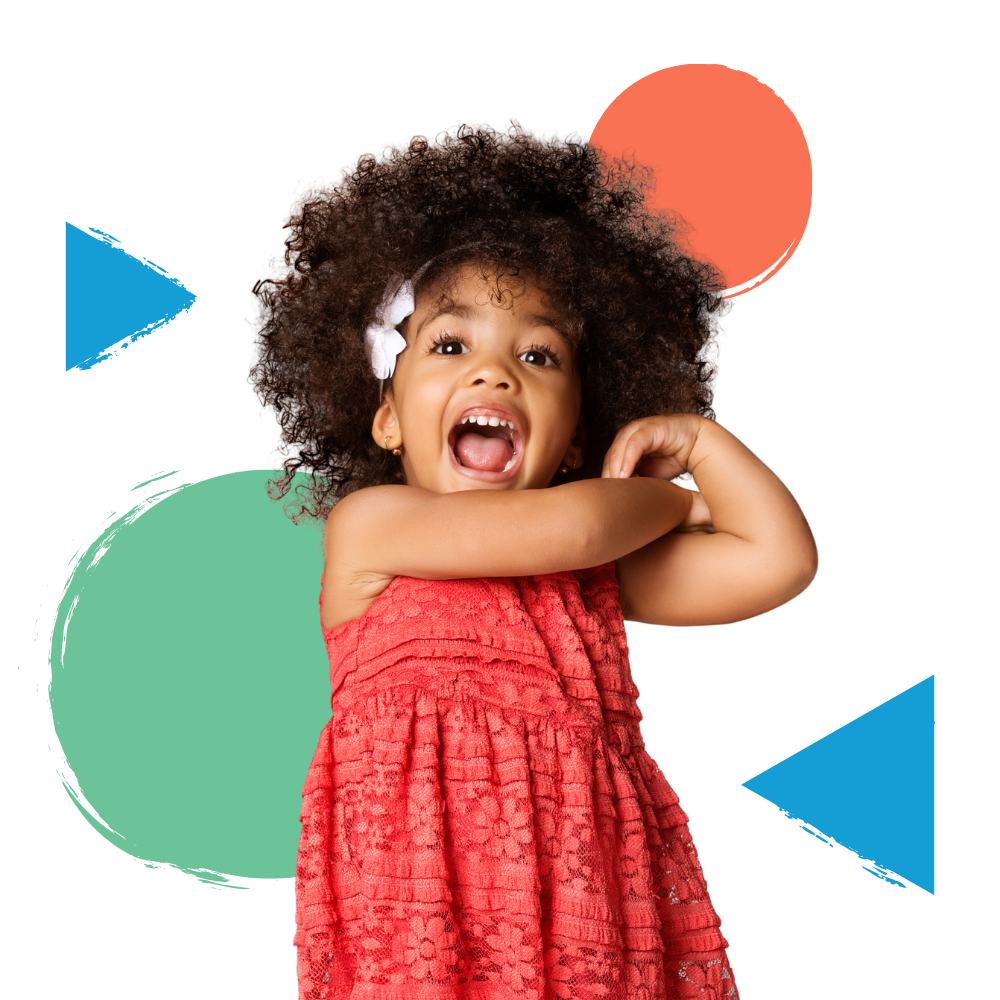 A little girl in a red dress with a flower in her hair.