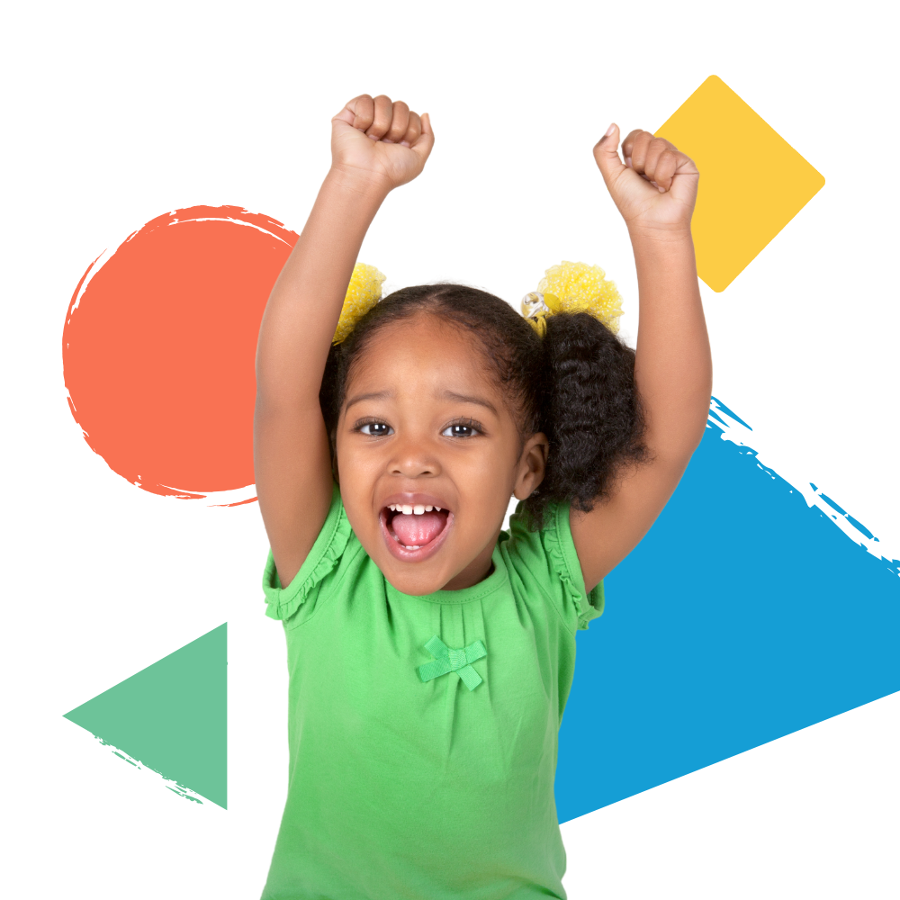 A little girl in a green shirt is raising her arms in the air.