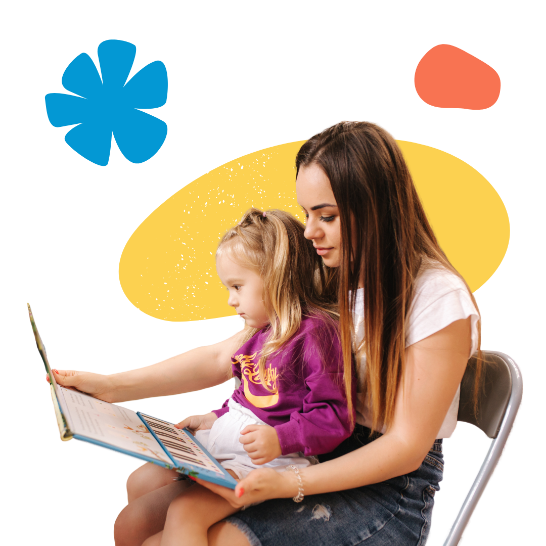 A woman is sitting in a chair reading an interactive book to a little girl.