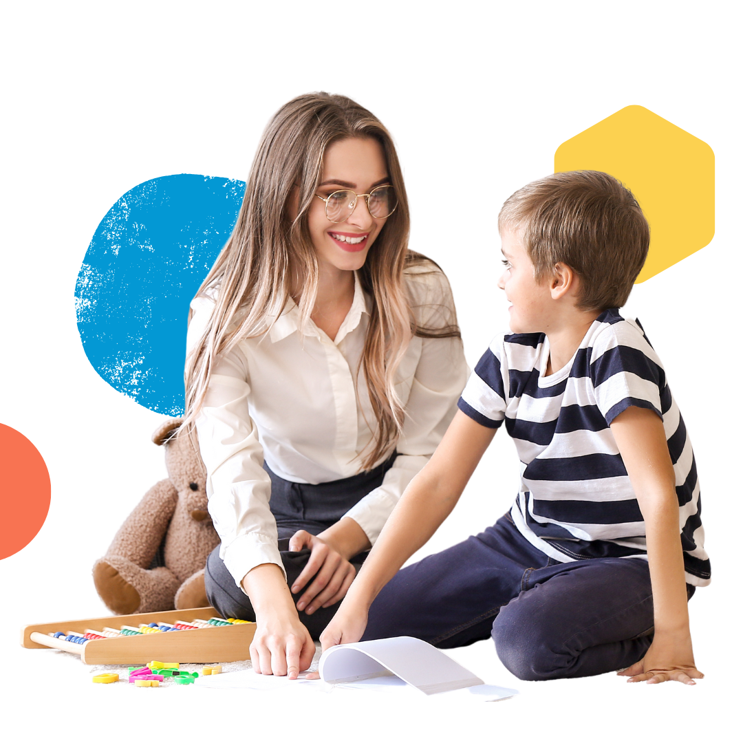 A woman and a boy are sitting on the floor playing with toys.