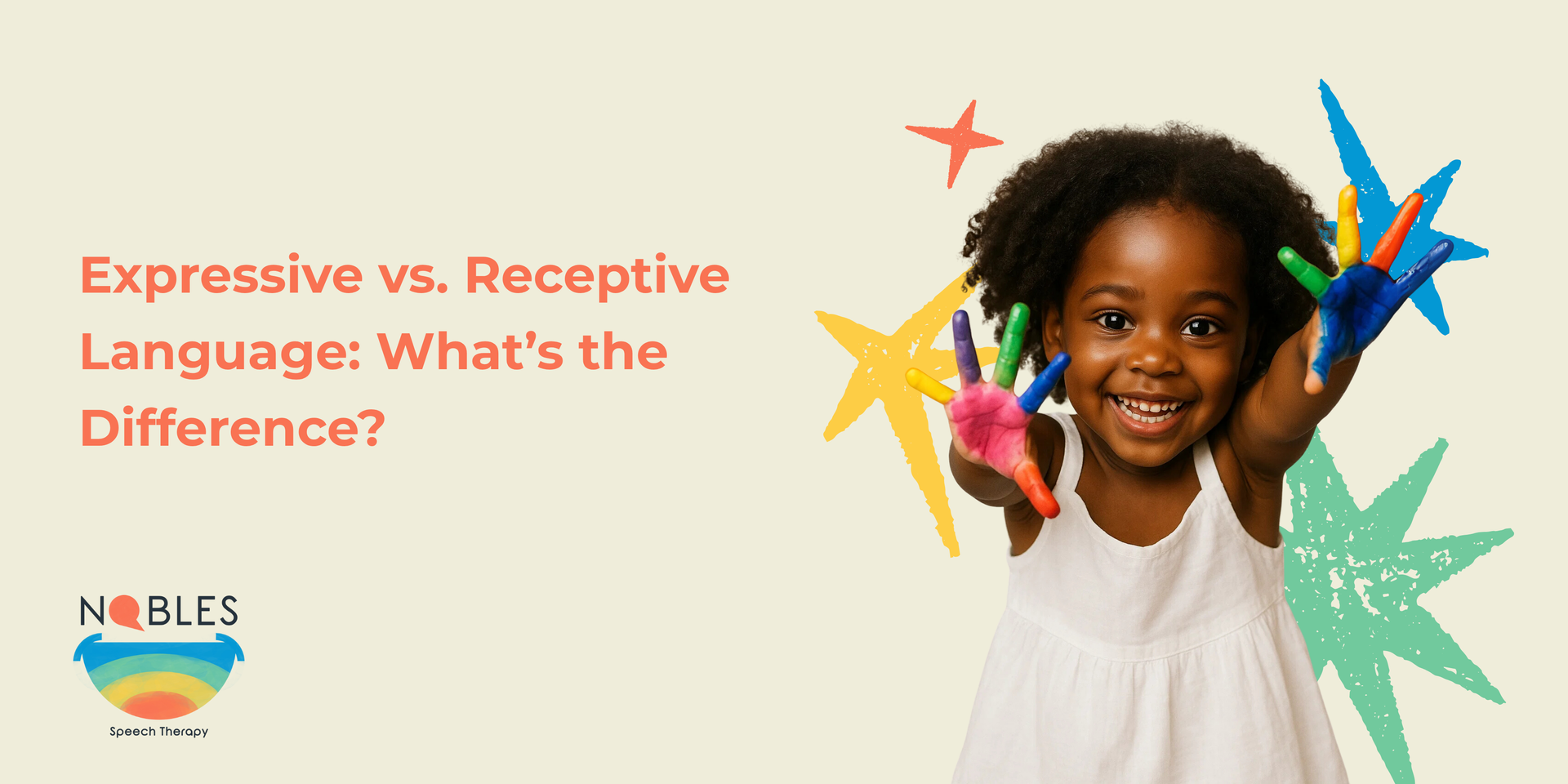 A little girl is holding a bunch of crayons in her hands.