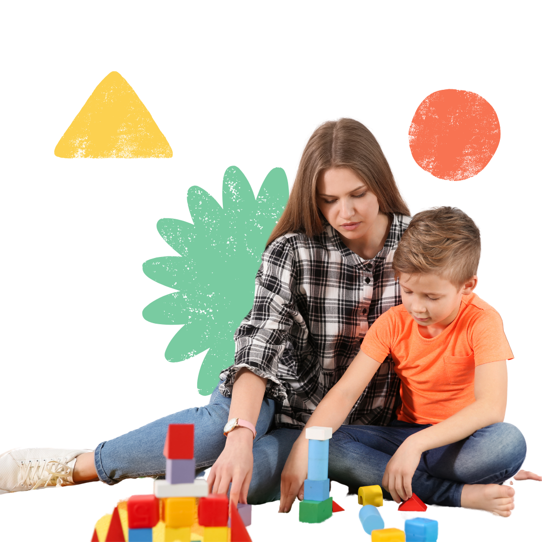 A woman and child are sitting on the floor playing with blocks.