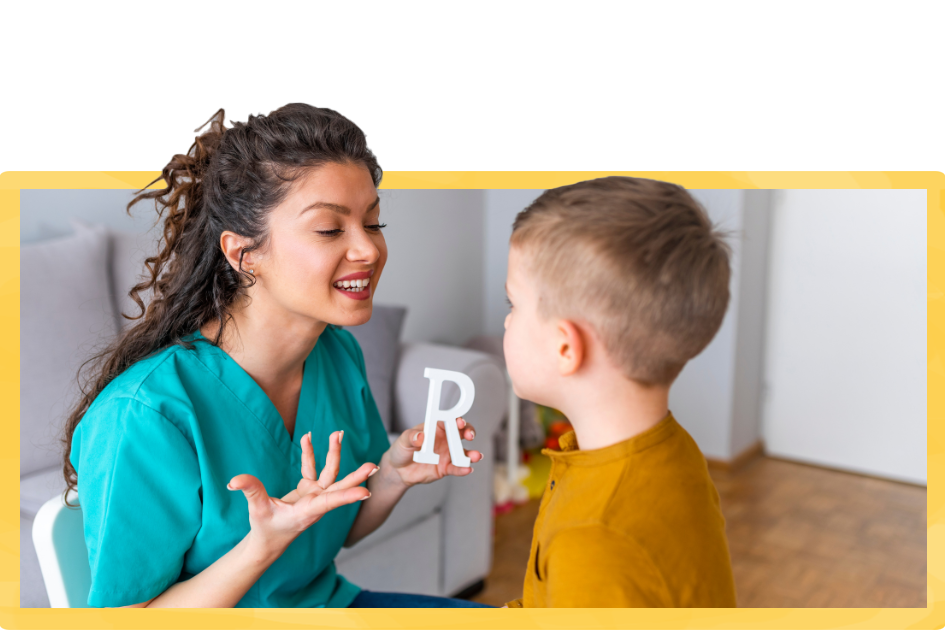 speech therapist teaches the boy to say words with R