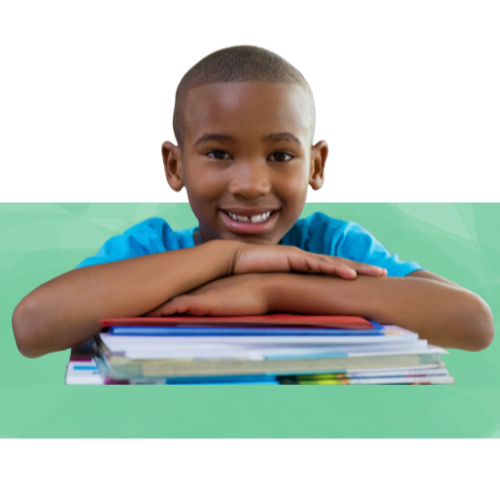 portrait of an African-American schoolboy leaning on desk