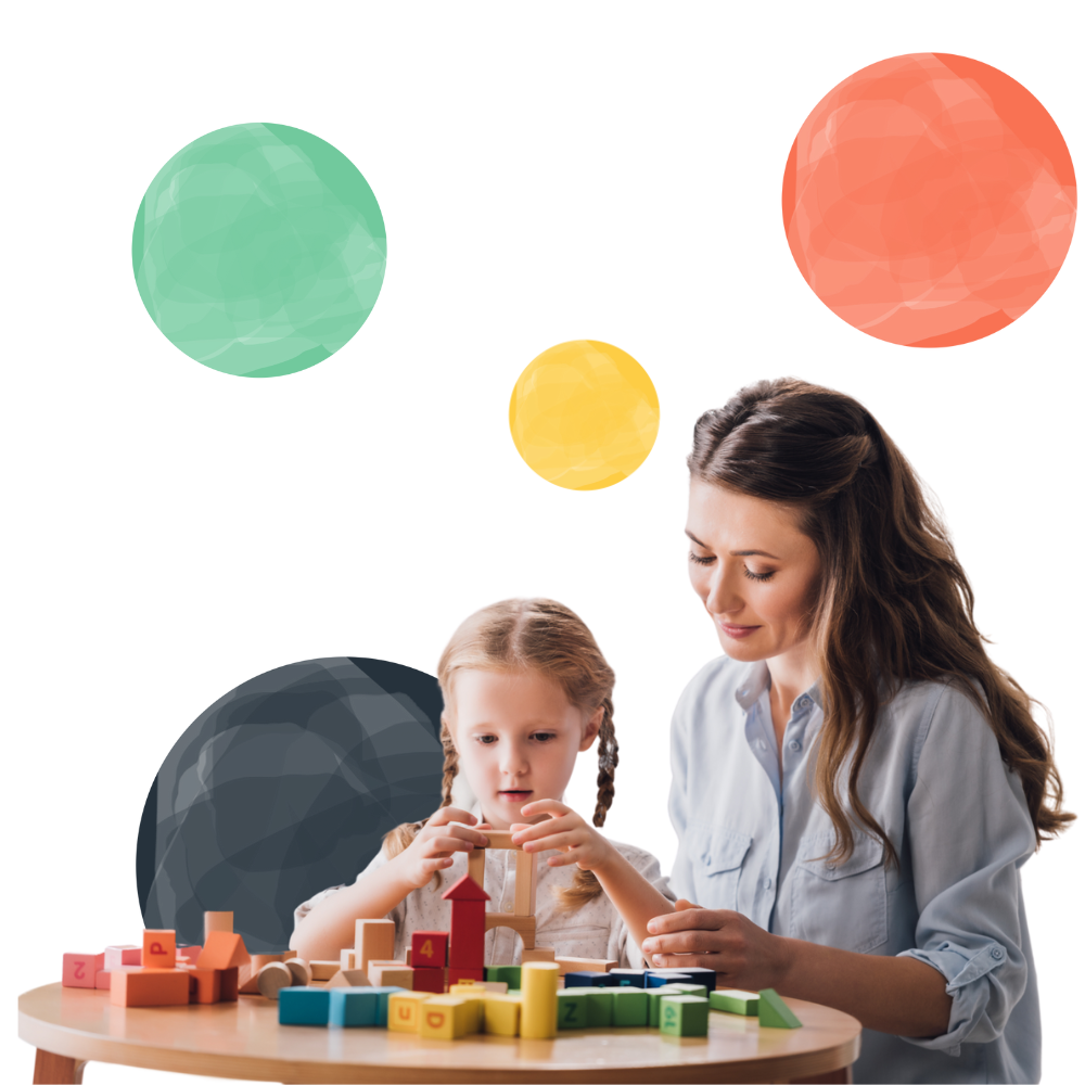 therapist playing blocks with little child with autism syndrome