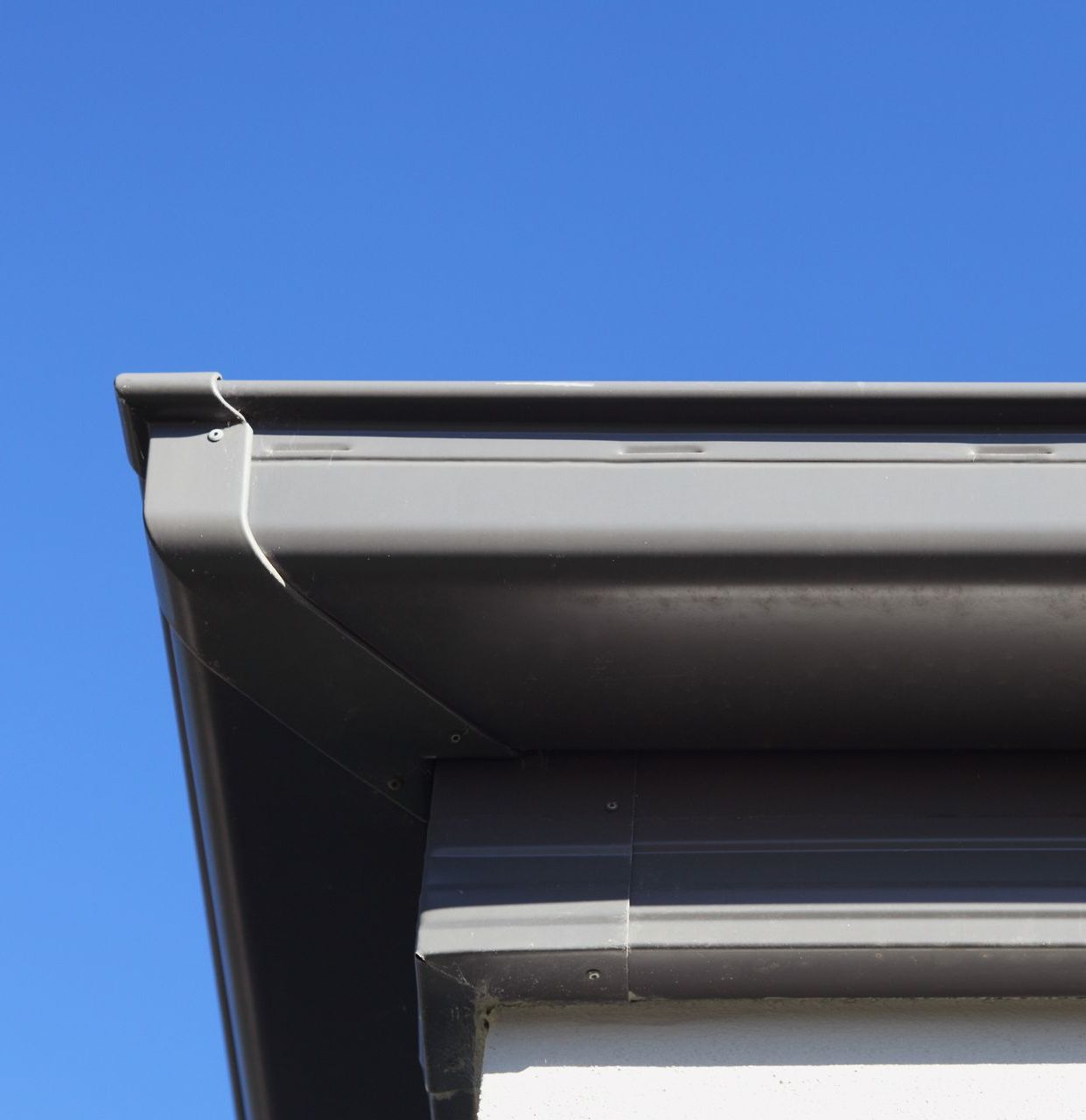 Metal Gutter Securely Fastened with Screws — Roofer in Douglas, QLD