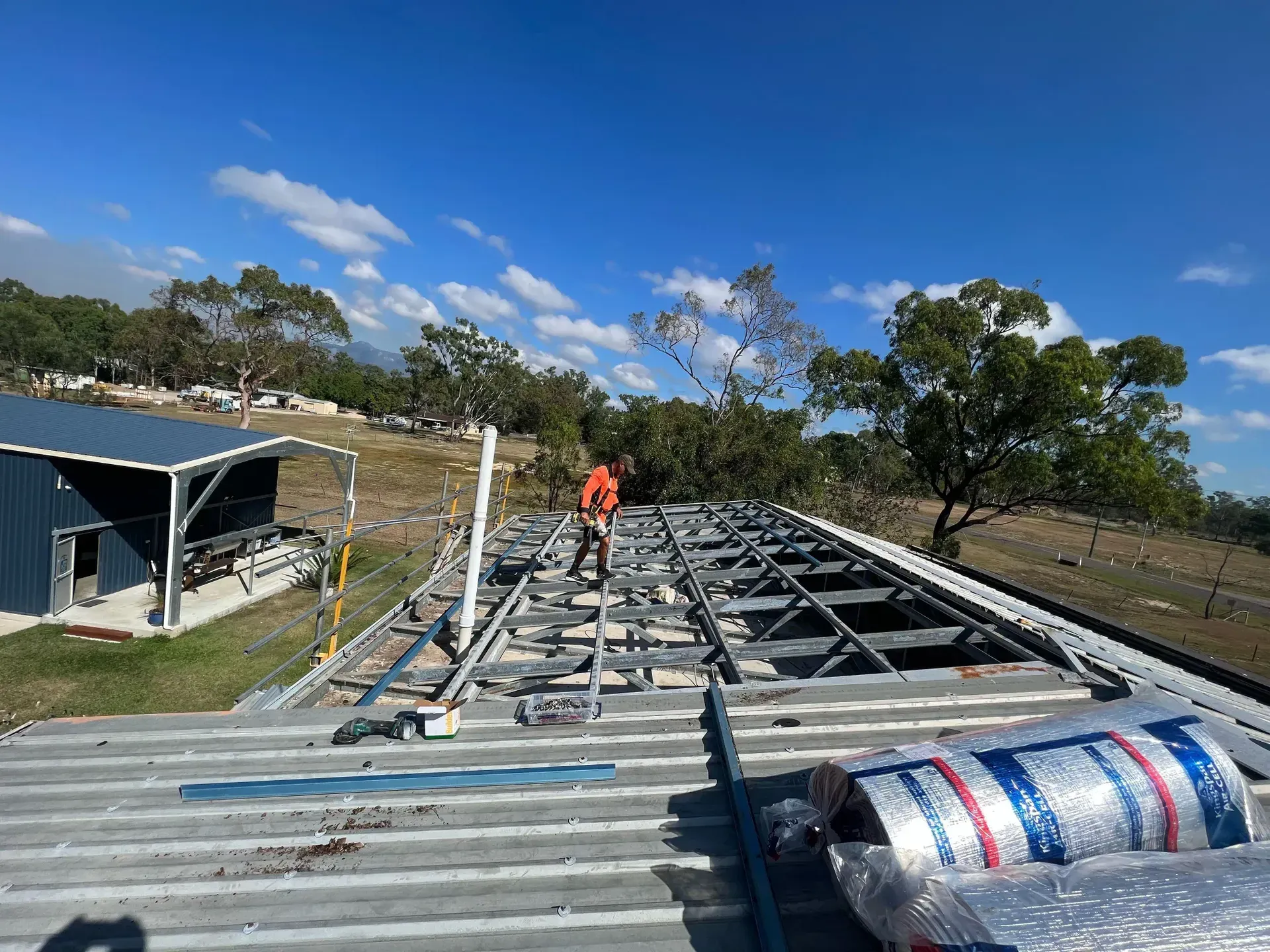 Skilled Roofer Installing a Fresh Roof — Roofer in Douglas, QLD