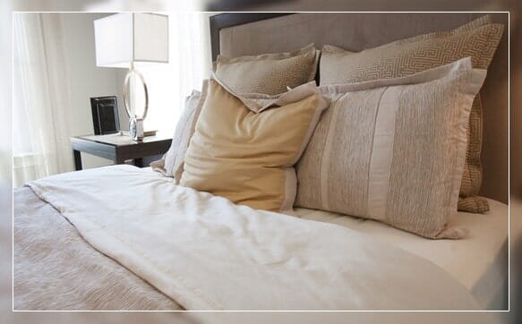 Pillows Arranged On Bed — Interior Design in Virginia Beach, VA