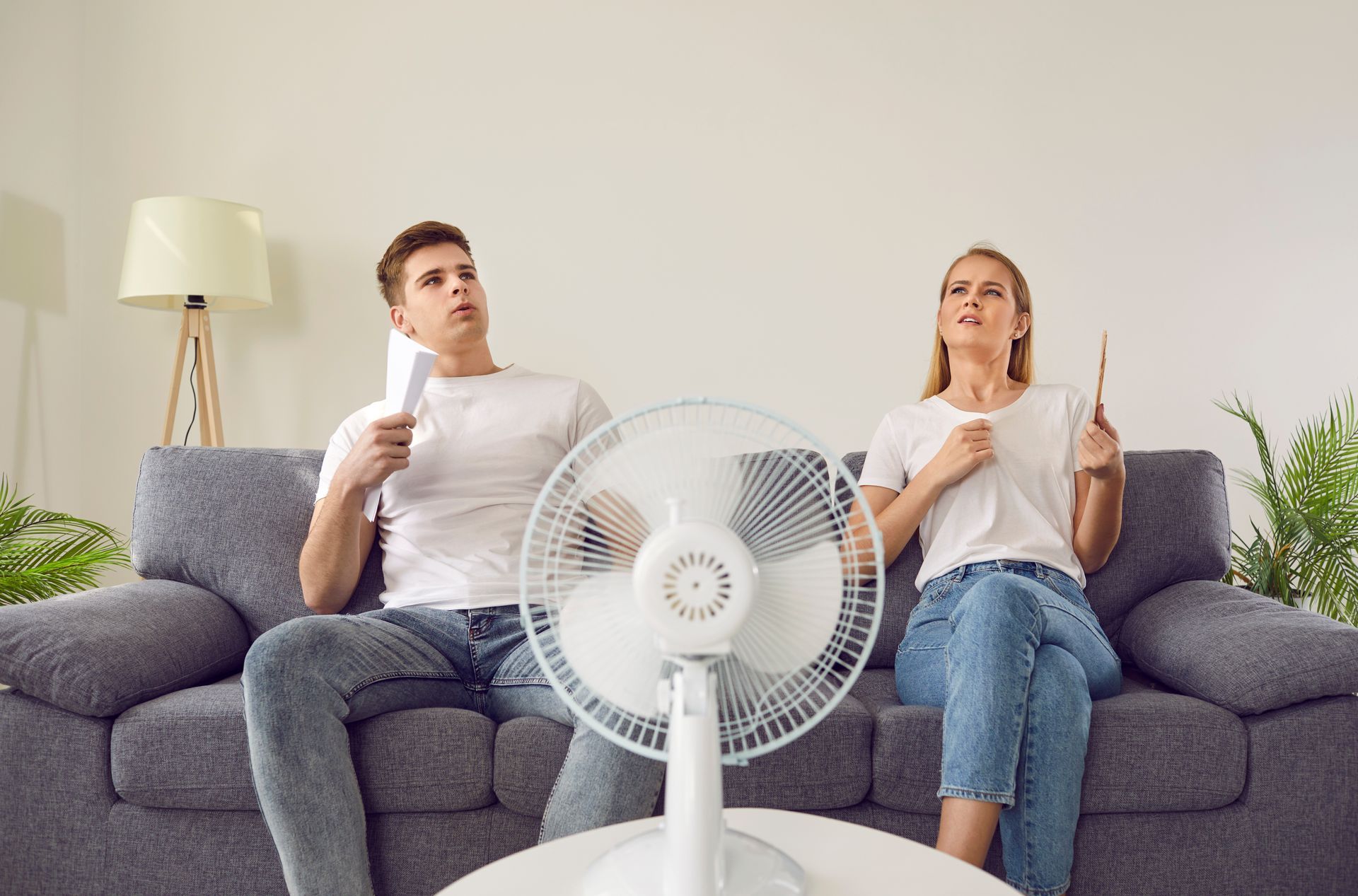 Homeowners struggling with uncomfortable indoor heat due to a malfunctioning AC.