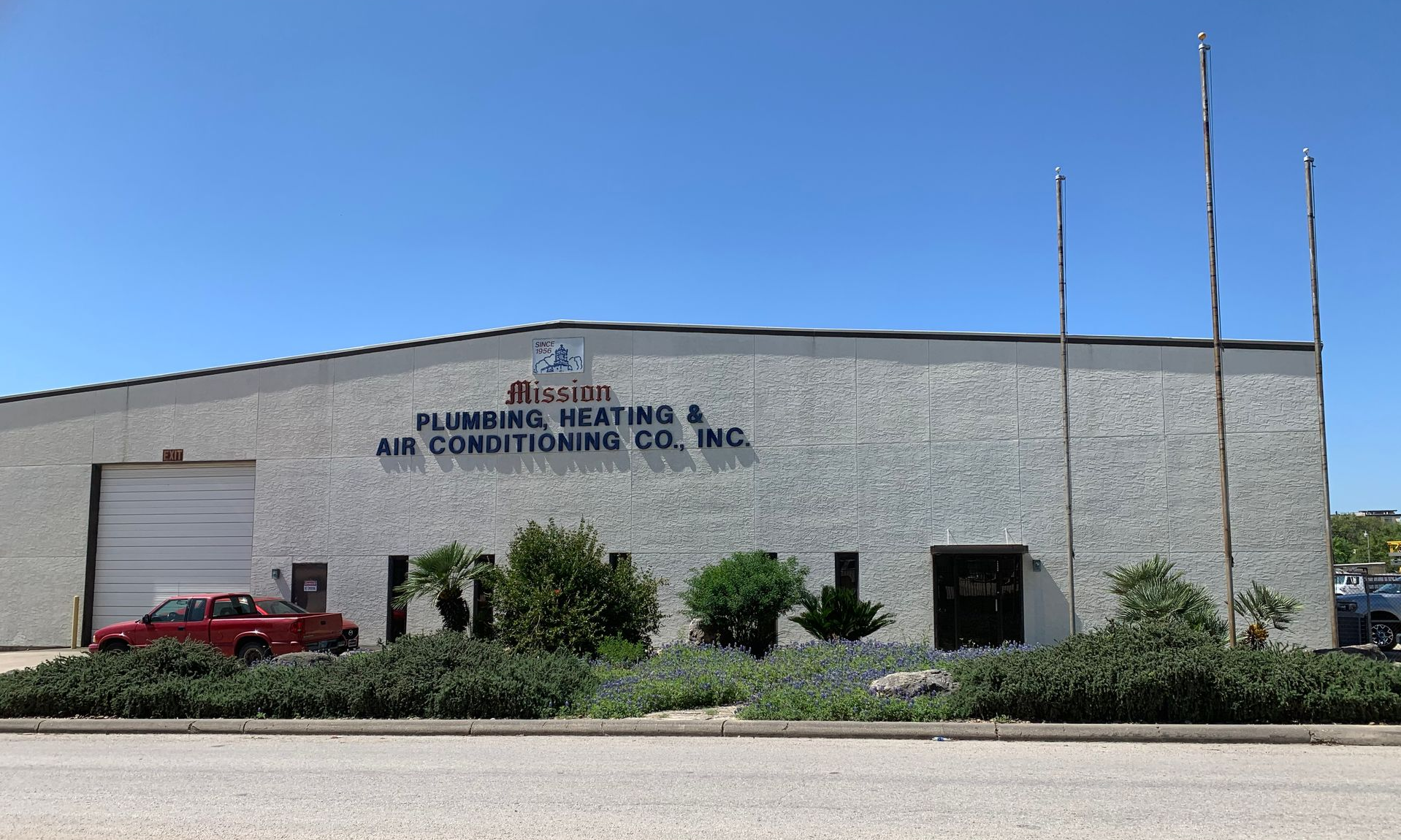 A handyman with a toolbox and wrench, leaning on a counter.