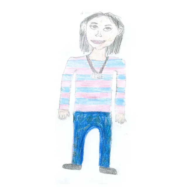 Person in blue jeans and striped shirt, with a lanyard, smiling.