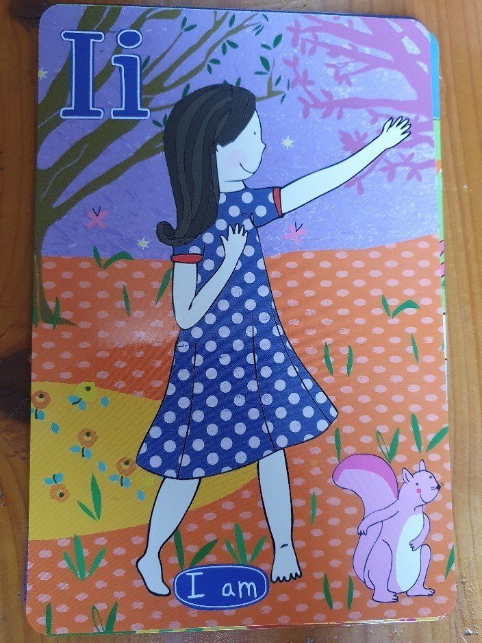Card with a girl in a blue dress, reaching for a tree. Pink squirrel. Letter 
