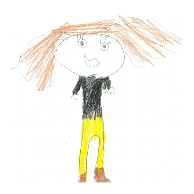 Person in blue jeans and striped shirt, with a lanyard, smiling.