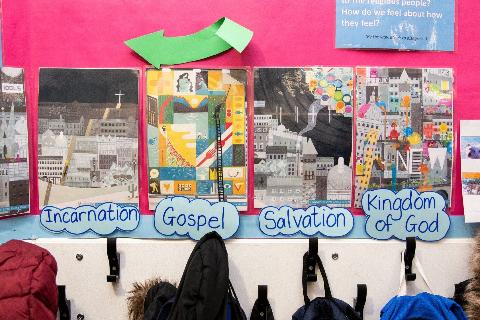 Artwork on a pink wall depicts biblical themes: Incarnation, Gospel, Salvation, Kingdom of God. Coats hang below.