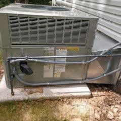 Outdoor AC unit installed by David Brown Heating & Cooling.
