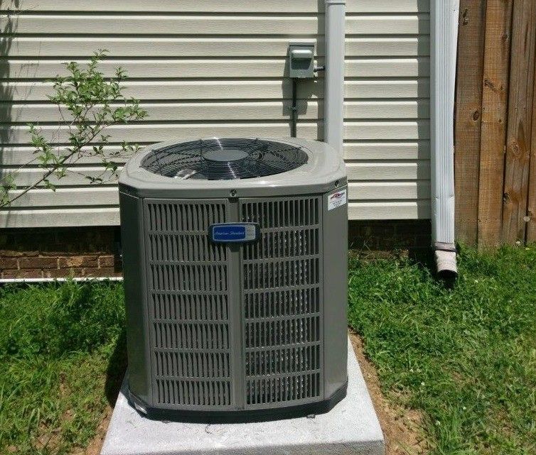 AC unit installation by David Brown Heating & Cooling.