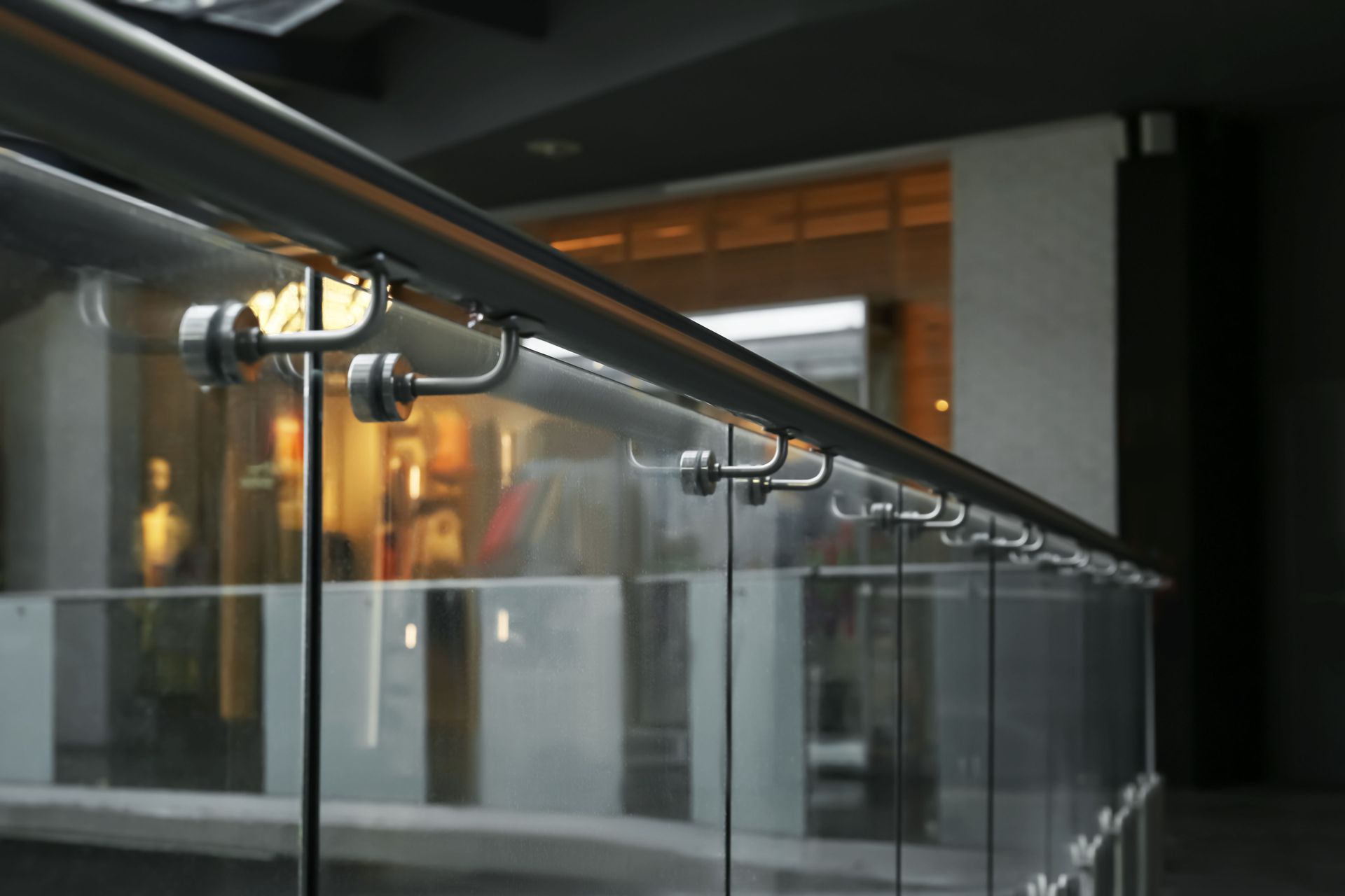 A close up of a glass railing in a building