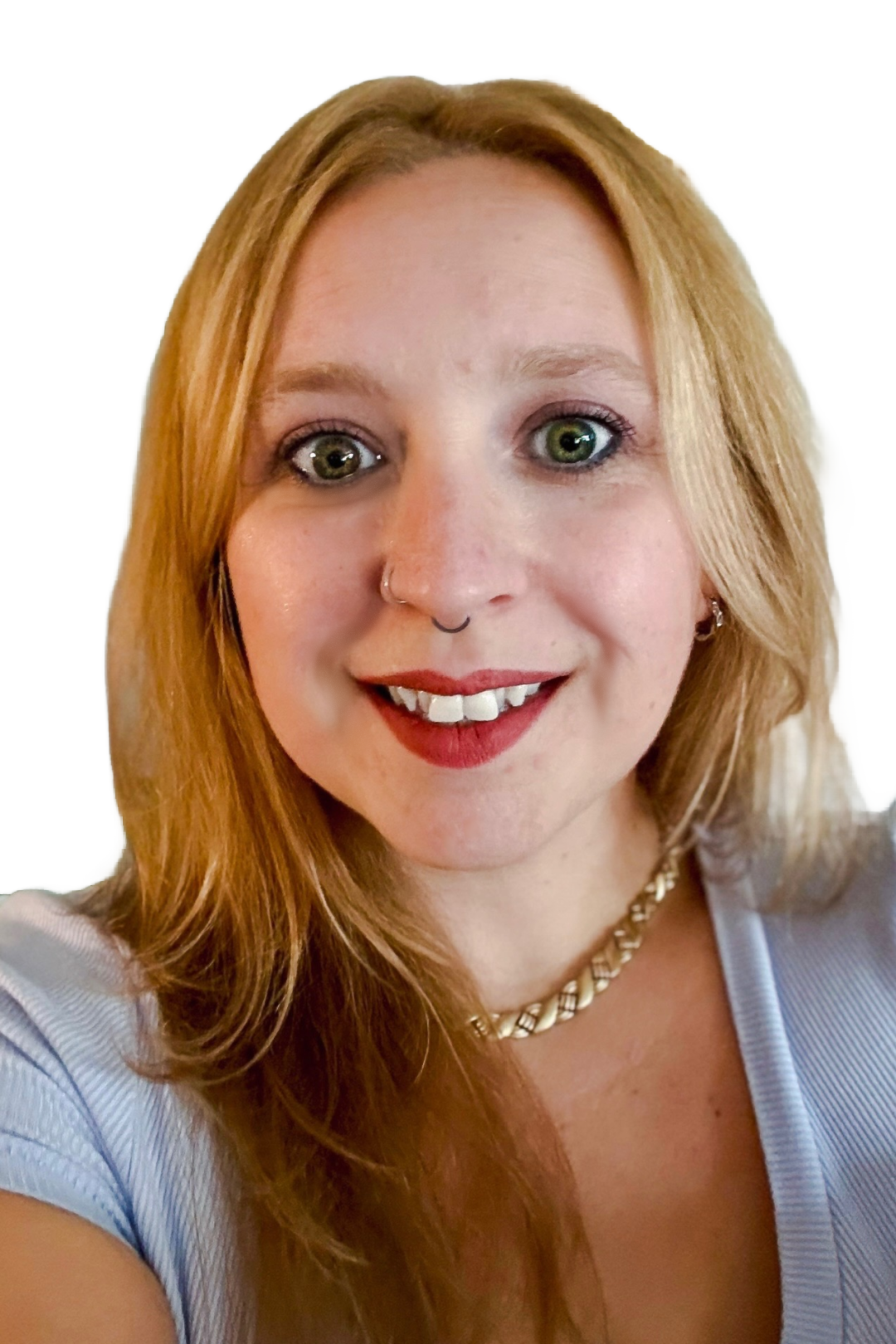 A woman with long blonde hair is smiling and wearing a necklace.