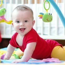 Infant Trying to Sit Up and Play at Daycare | Goffstown, NH | Educare Daycare & Learning Center
