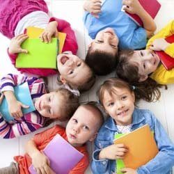Children Smiling and Doing Homework at Daycare | Goffstown, NH | Educare Daycare & Learning Center