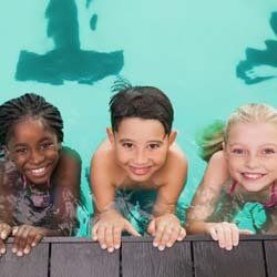 Children Smiling at Camera in Pool | Goffstown, NH | Educare Daycare & Learning Center
