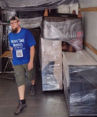 wrapped furnitures, and a Move Time Movers' crew