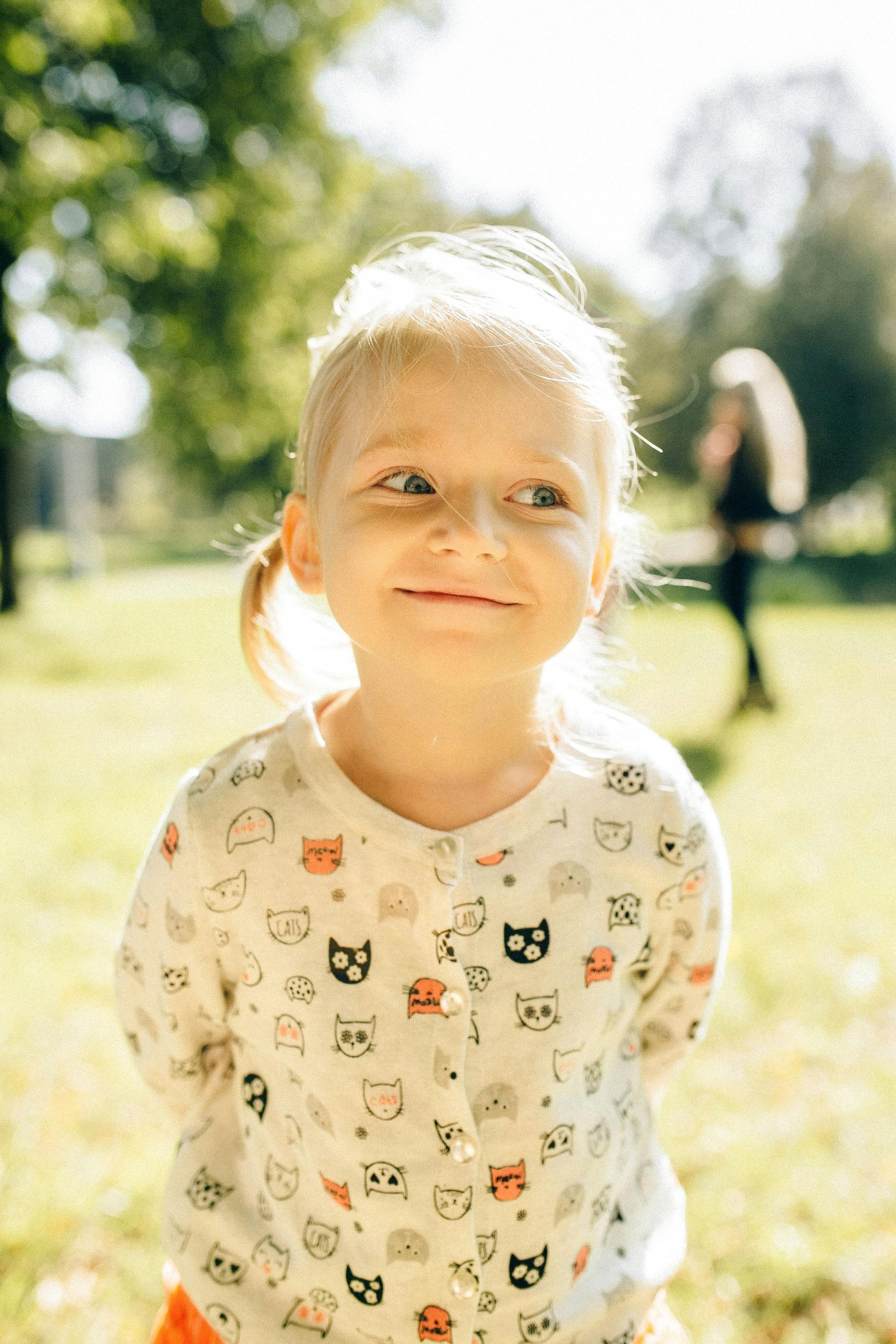 4th - 6th grade girl with big hair smiling