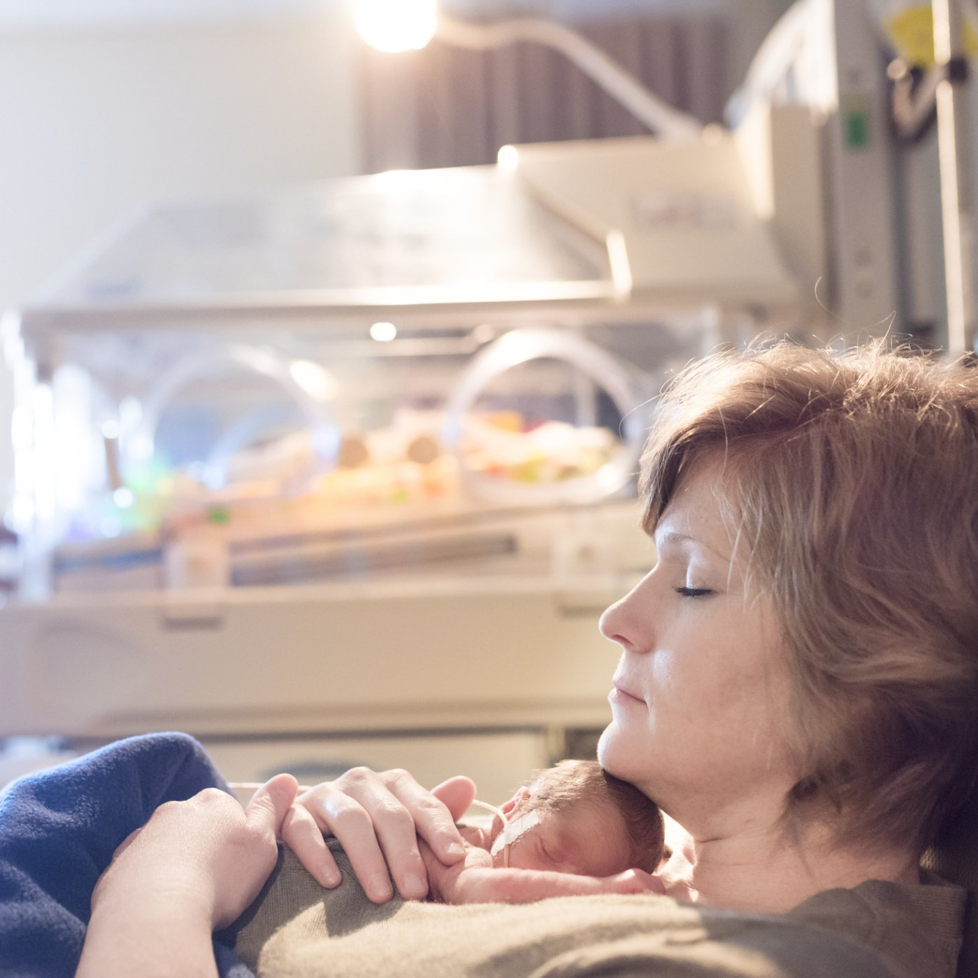Mother Holding a Newborn Baby - Fort Wayne, IN - Charis et Veritas LLC