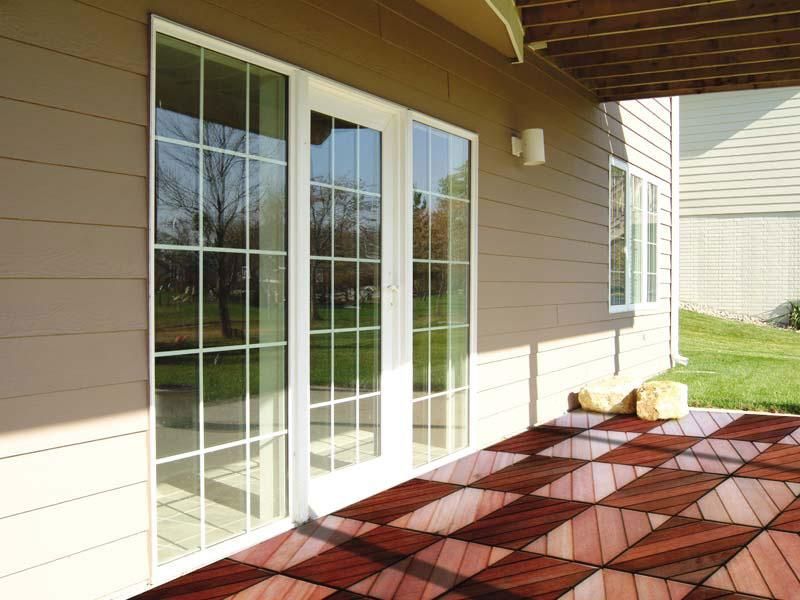 A house with sliding glass doors and a wooden floor.