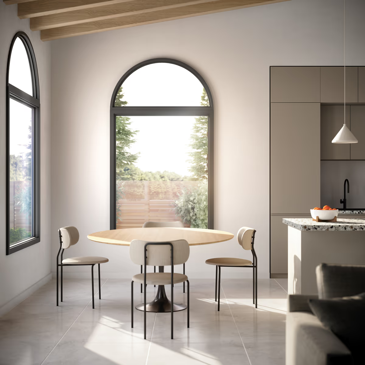 A dining room with a round table and chairs.