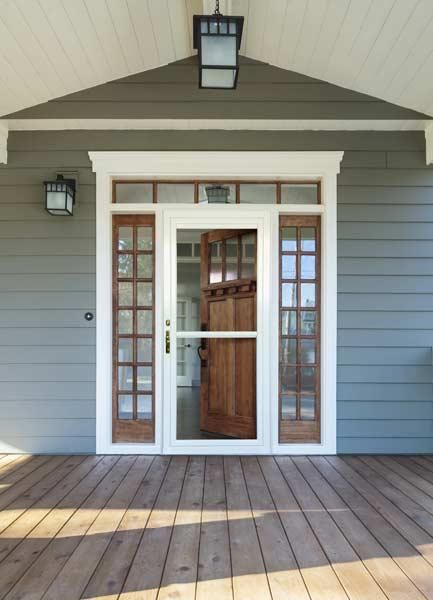 The front door of a house with a sliding glass door.