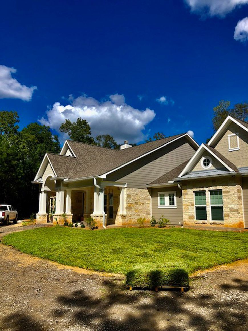 A landscaped yard in New Waverly TX by All Star Lawn and Landscape