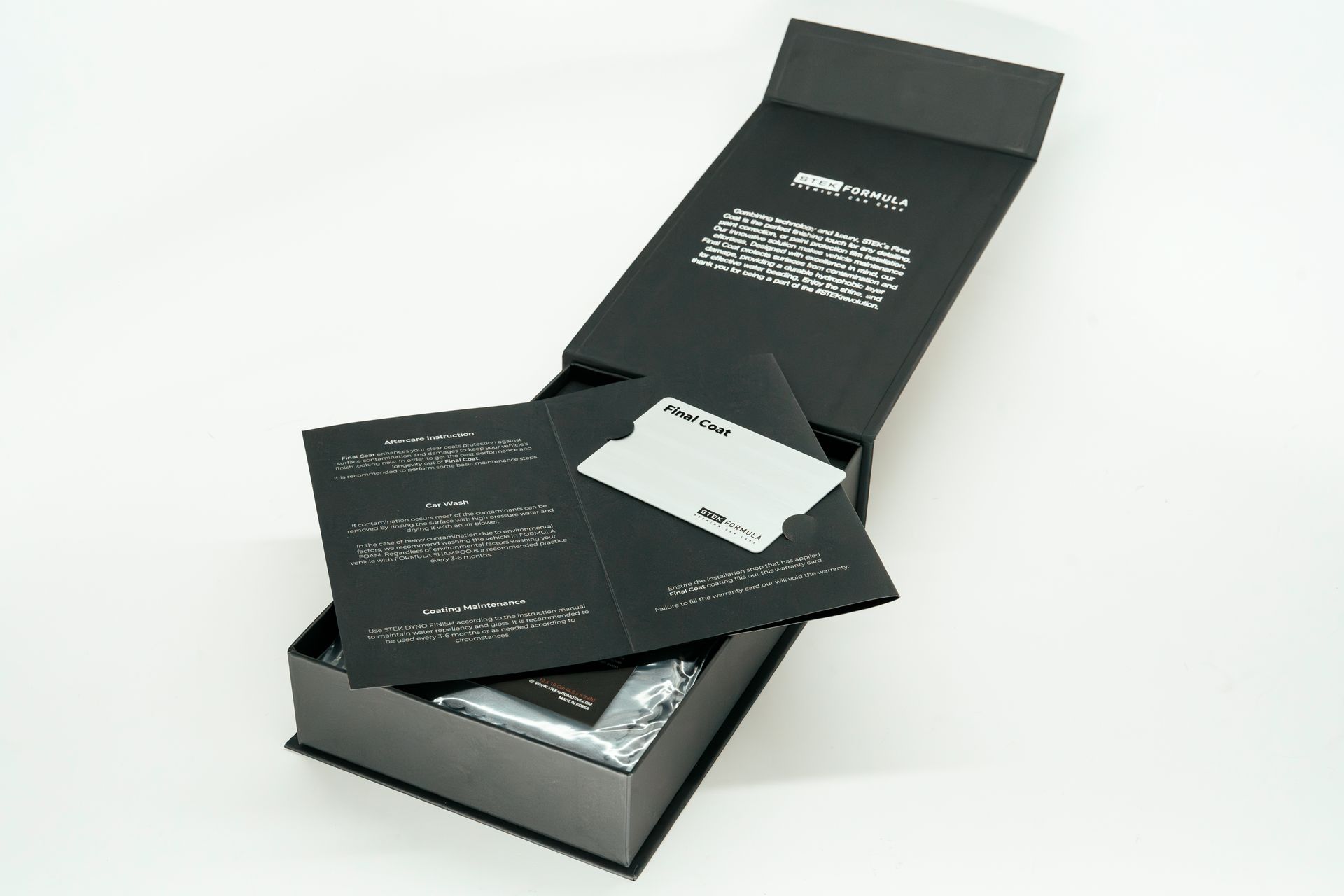Silver vape device in a black presentation box with velvet lining