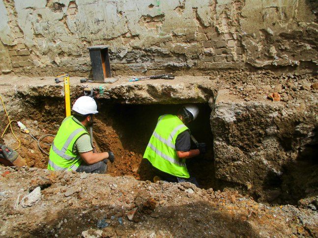 Two Construction Workers are Working in a Hole in the Ground — Q-Pile Foundations in Maroochydore, QLD