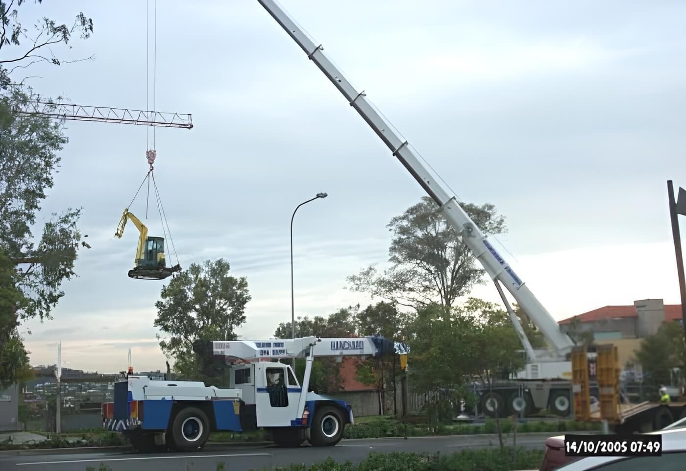 A Blue and White Truck With a Crane Attached to It — Q-Pile Foundations in Gympie, QLD