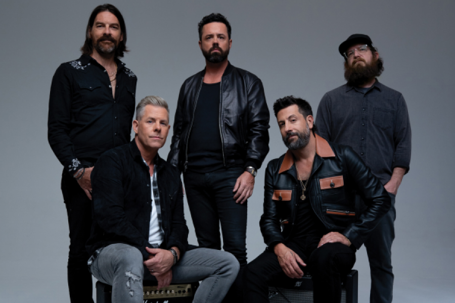 A group of men are posing for a picture together.