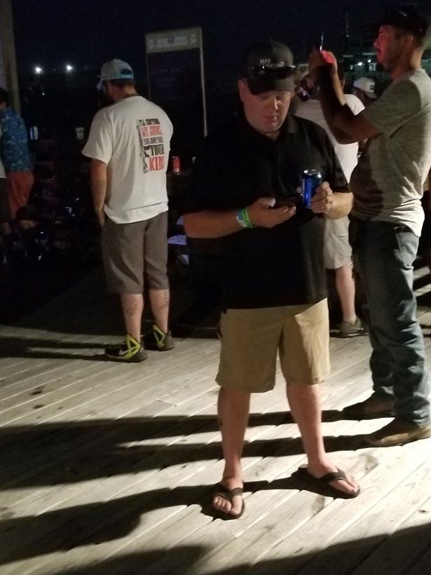 A man in a black shirt with the word fox on it