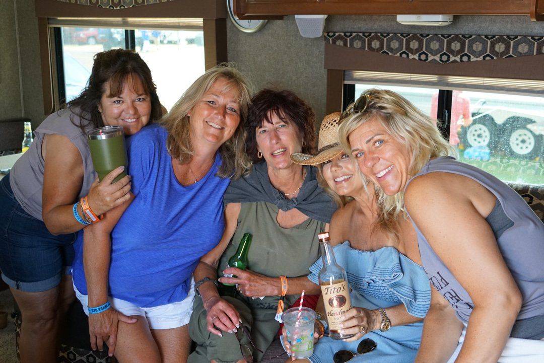 A group of women are posing for a picture in a rv.