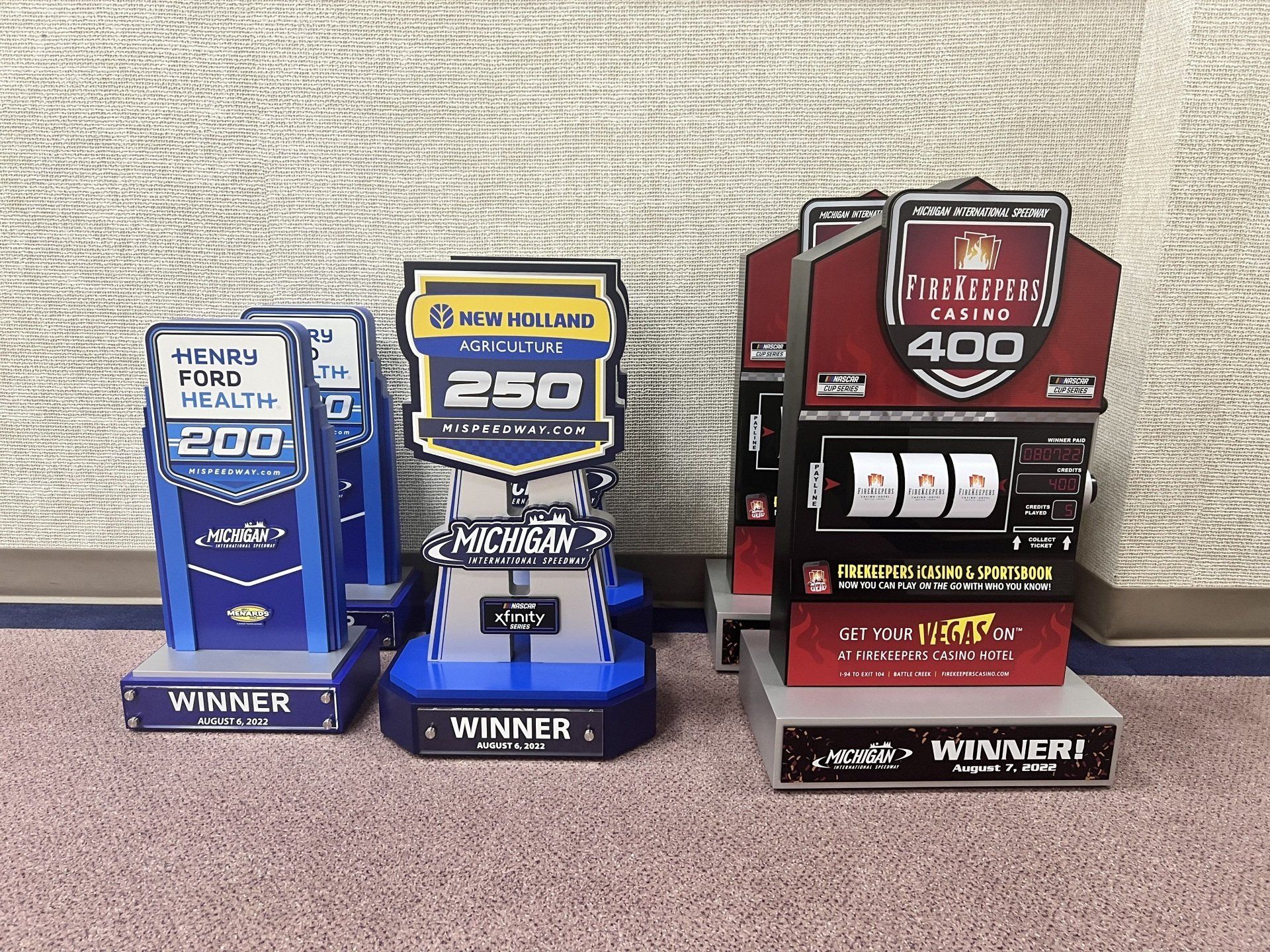 A stack of trophies with one that says 250 on it